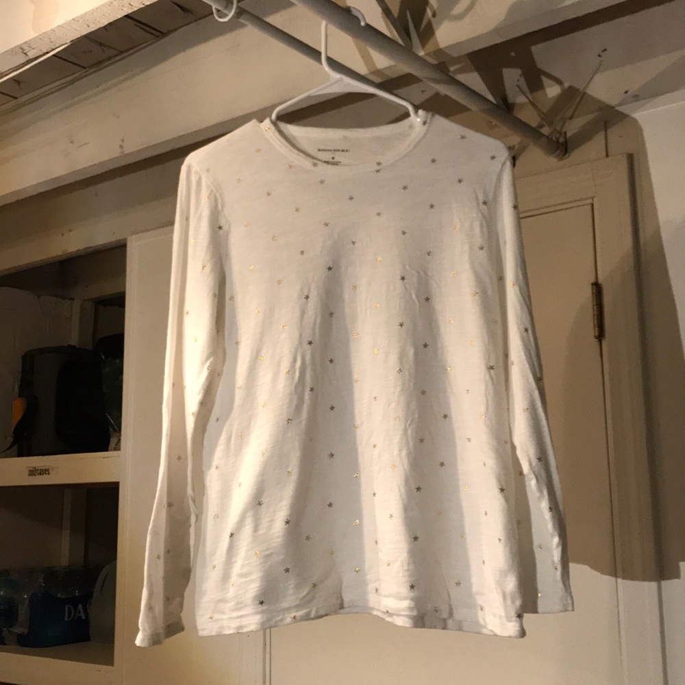 white long sleeve shirt with gold stars